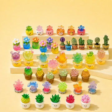 Assorted miniature resin cactus, flower, and succulent pots from Tiny Relics
