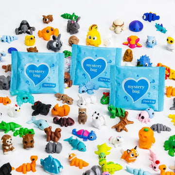 Blue mystery bags with colorful articulated animal figures