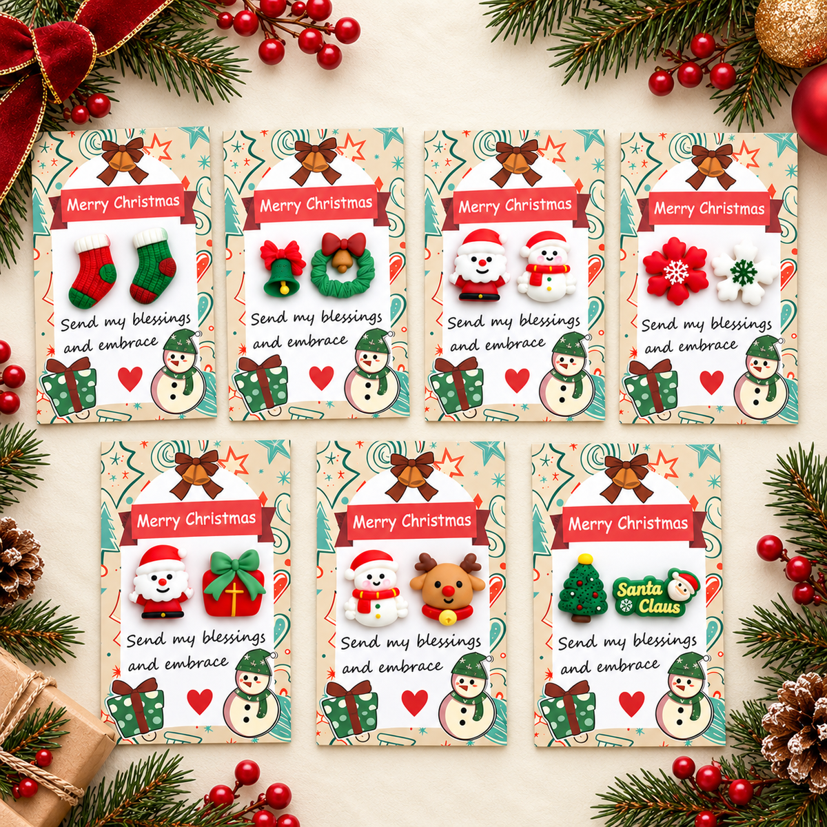 Seven Christmas pocket hug cards with fourteen resin charms in a festive holiday flat lay