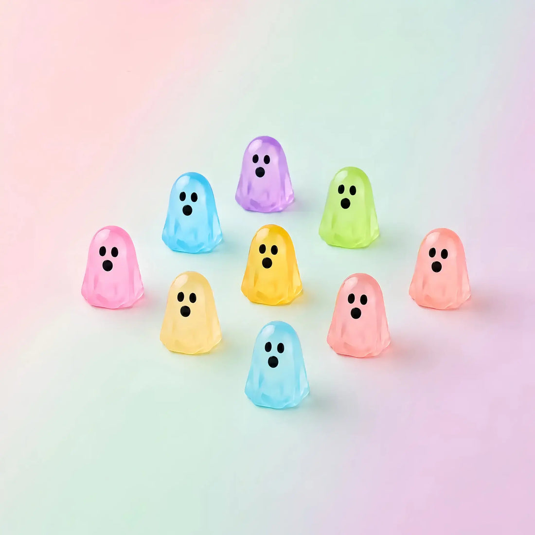 Colorful translucent mini ghost figures on a pastel background