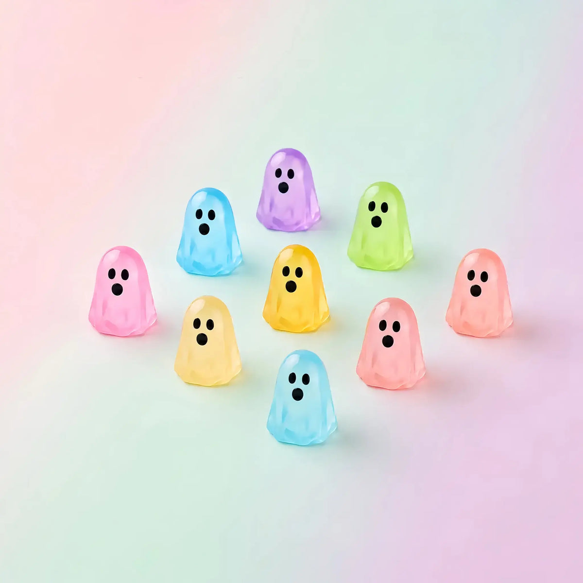 Colorful translucent mini ghost figures on a pastel background