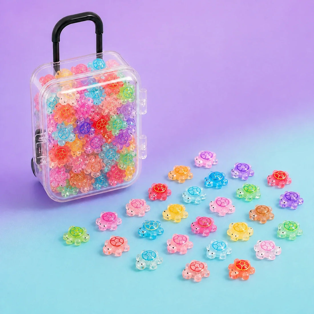 Mini resin turtle charms with clear storage box on a colorful purple and aqua background