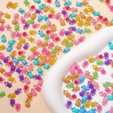 Random assortment of multicolor translucent mini turtle charms